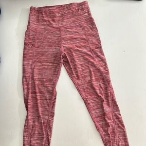 Red size small leggings. Pocket on right leg. Used- Good condition.